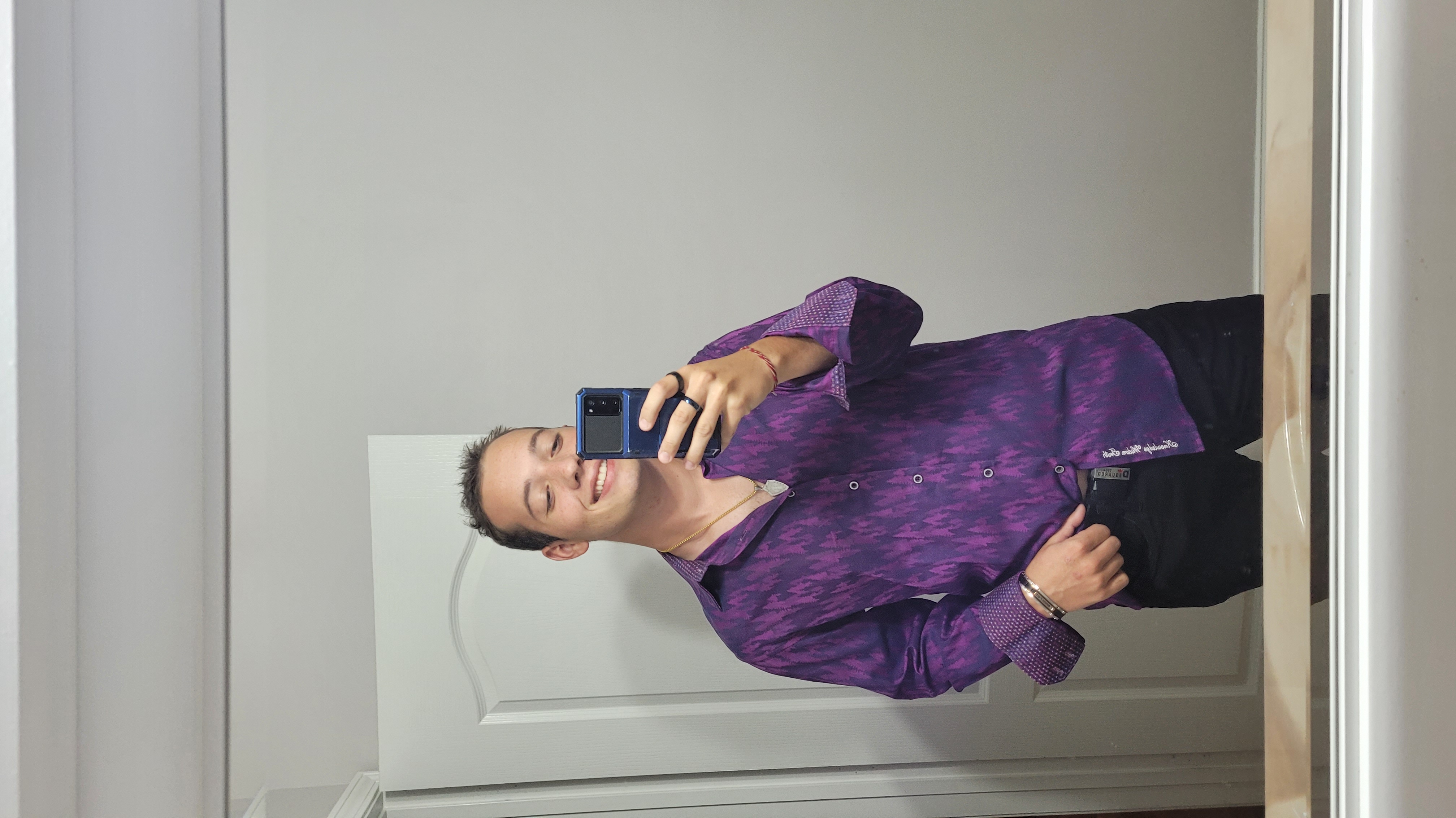 Ivans mirror selfie with a nice purple button down.